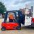 orange forklift loading van with drinks - Champers Wholesale